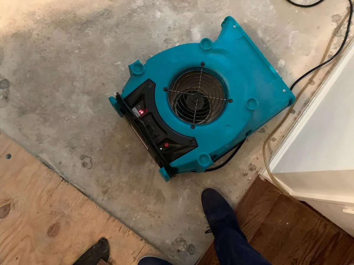 Air mover drying subfloor during Leak Detection & Repair in Upper Nazareth